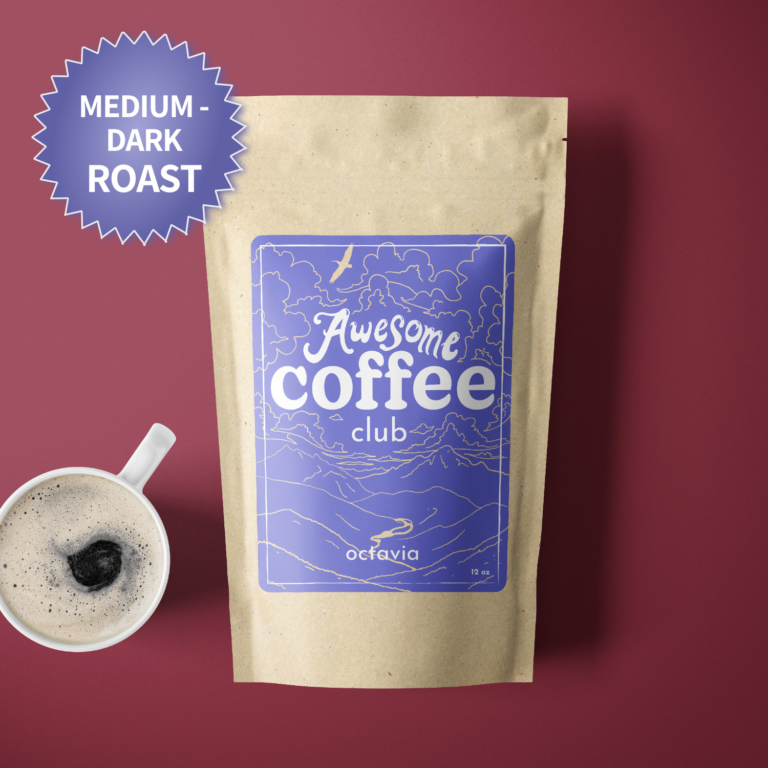 A photo of a brown bag of coffee with a light purple label that shows a mountain scene and has the text "Awesome Coffee Club; Octavia". The bag sites atop a maroon background with a cup of coffee next to it. There is a purple badge in the lefthand corner that reads "Medium-Dark Roast".